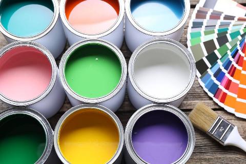 Cans of paint and paint swatches. 
