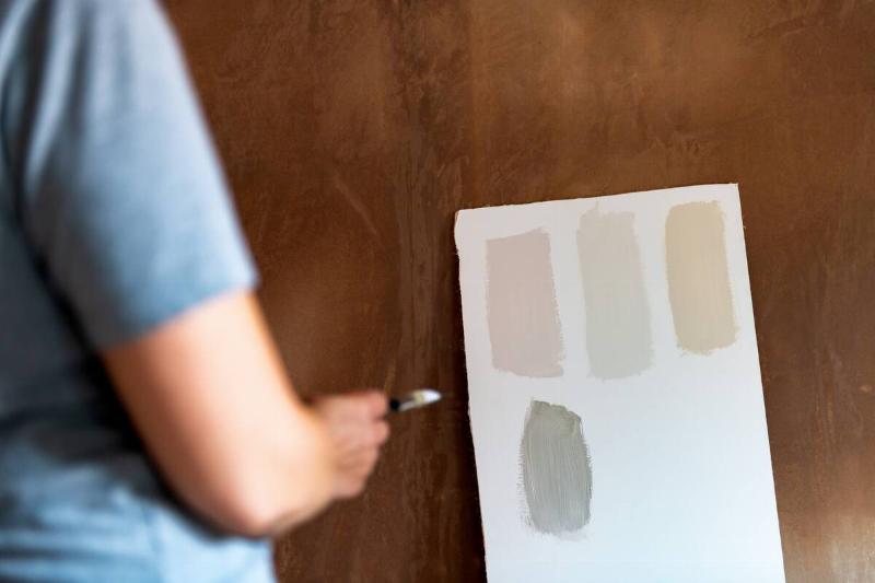 Paint with different finishes on a piece of paper. 