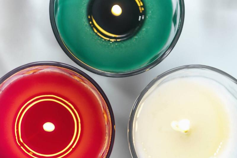 Christmas candles that are starting to melt out from the center.