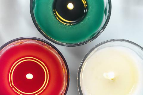 Christmas candles that are starting to melt out from the center.