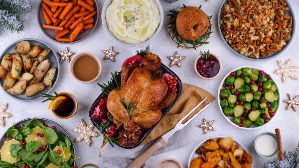 Christmas festive dinner with baked chicken and traditional dishes.