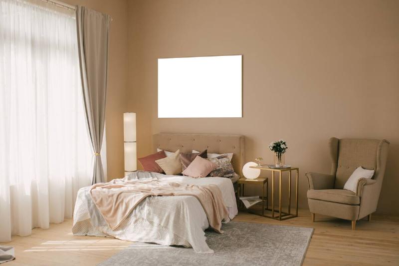 A bedroom painted in a shade of warm taupe. 