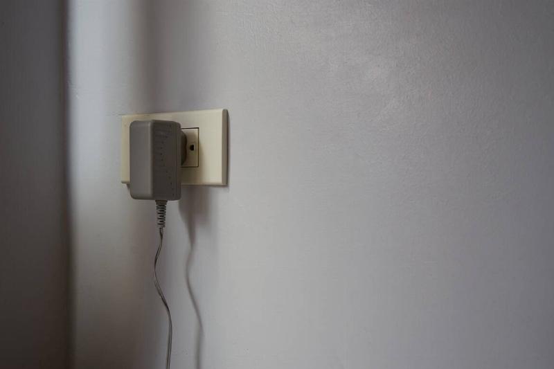 Cord plugged into electrical outlet.