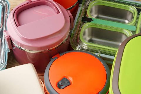 Mismatched plastic food containers. 