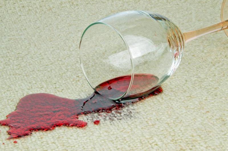 Red wine spilled on carpet. 