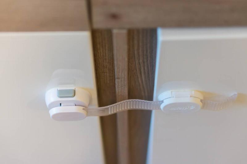 A secure, child-proof lock on a closet door.
