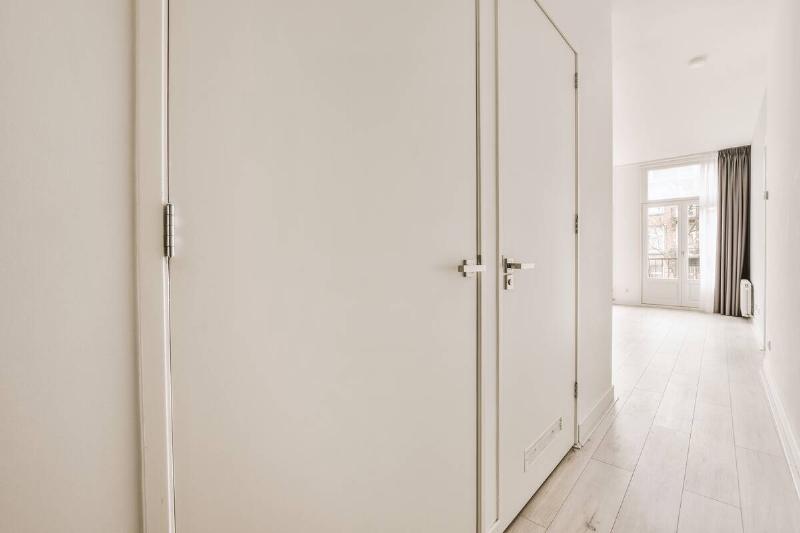 Closed doors in the hallway of a house. 