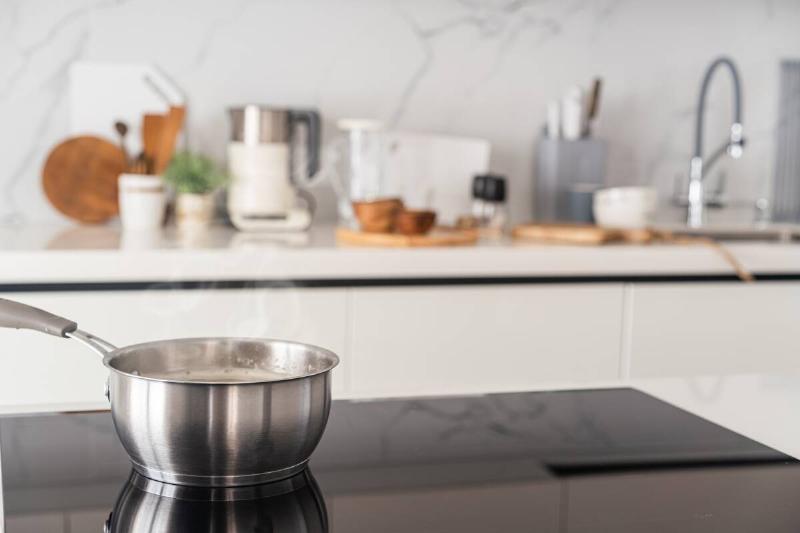 Hot pot on black countertop. 