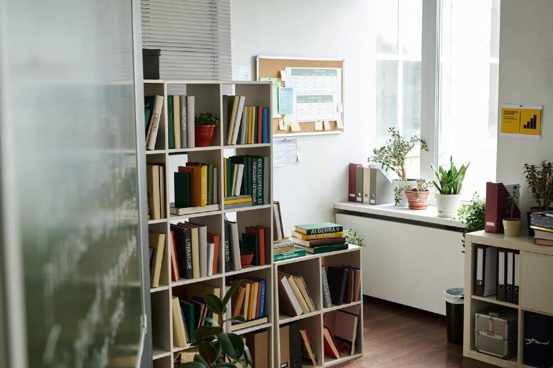 Organized office space with bookshelves.