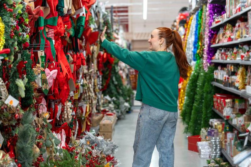 Woman shopping for Christmas decorations. 