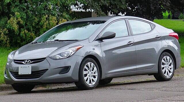 Grey 2013 Hyundai Elantra parked along the side of a road