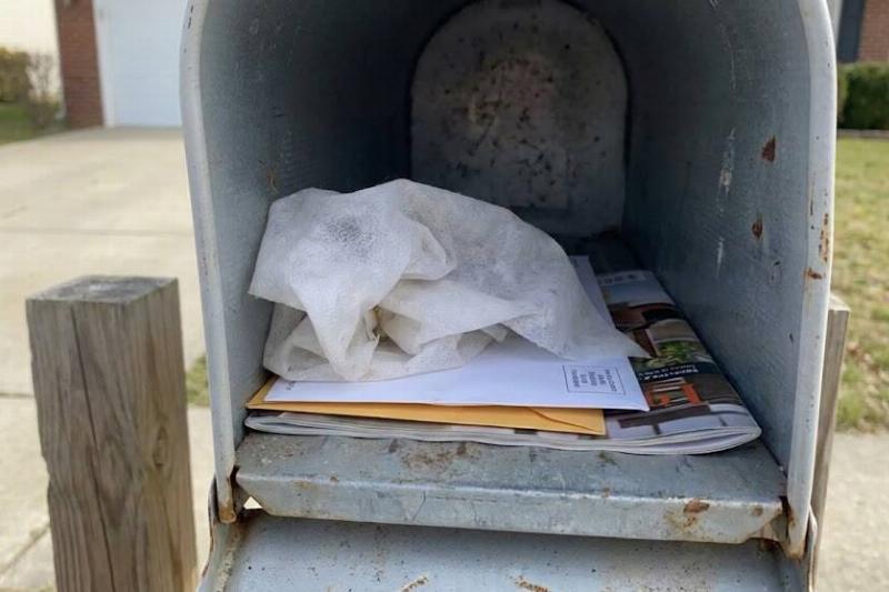 A dryer sheet inside of a mail box. 