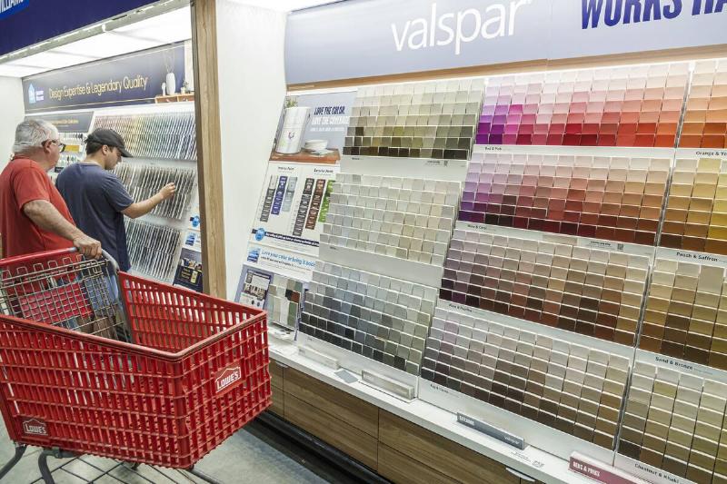 Lowe's Home Improvement, hardware store, Father and son in paint aisle.