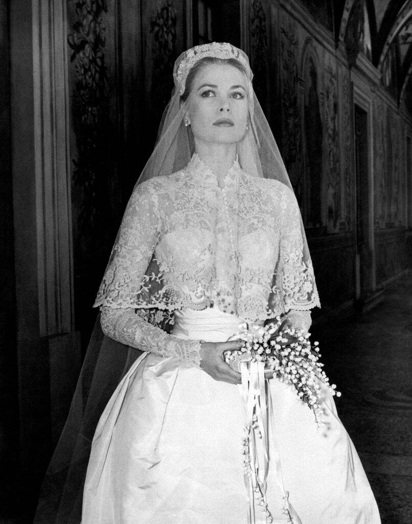 Grace Kelly standing in her wedding dress