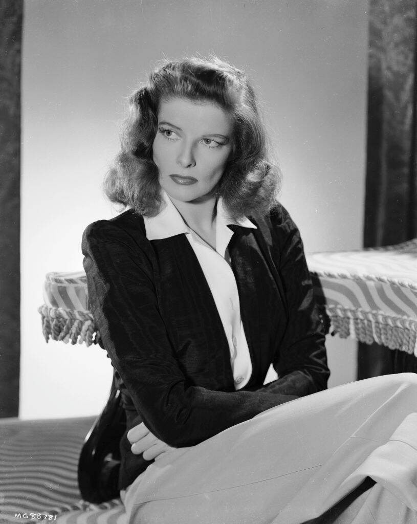 Katharine Hepburn sitting in a chair