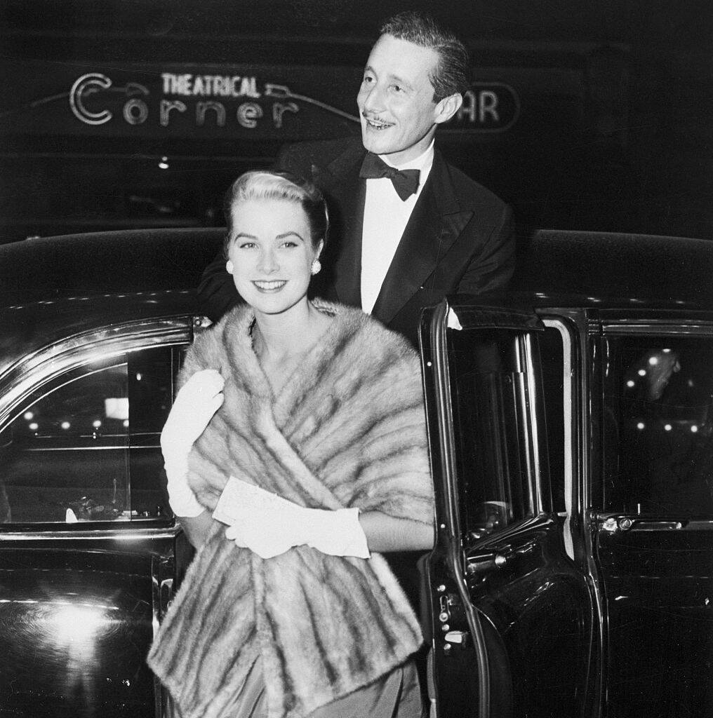 Grace Kelly and Oleg Cassini exiting a vehicle