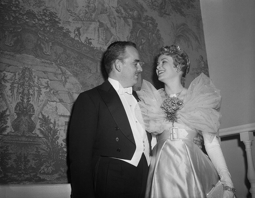 Prince Rainier and Grace Kelly standing together in fancy dress
