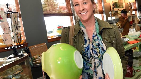 A woman holding a green Pyrx bowl. 