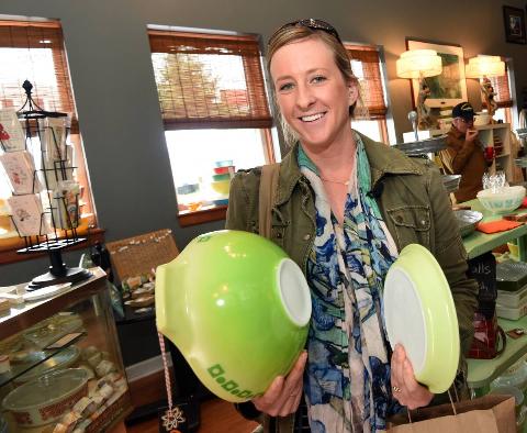 A woman holding a green Pyrx bowl. 