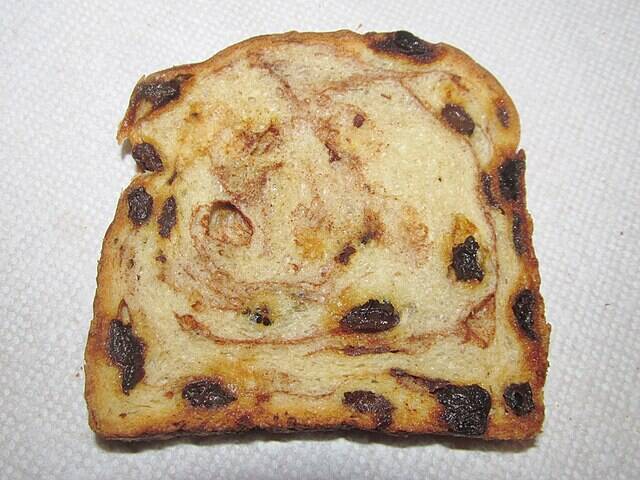Slice of Sun-Maid raisin cinnamon bread placed on a paper towel