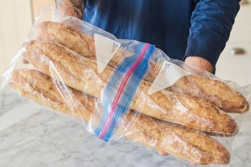 Two ziplock bags connected to hold baguettes. 