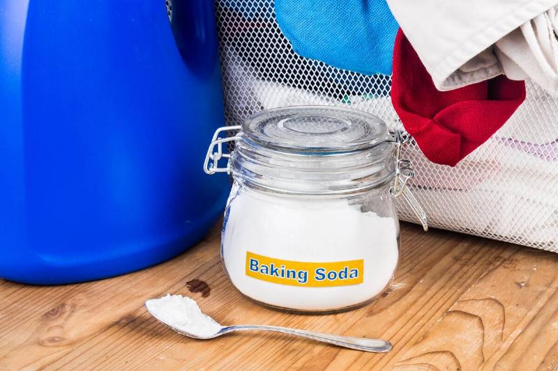 Baking soda in a jar and spoon. 