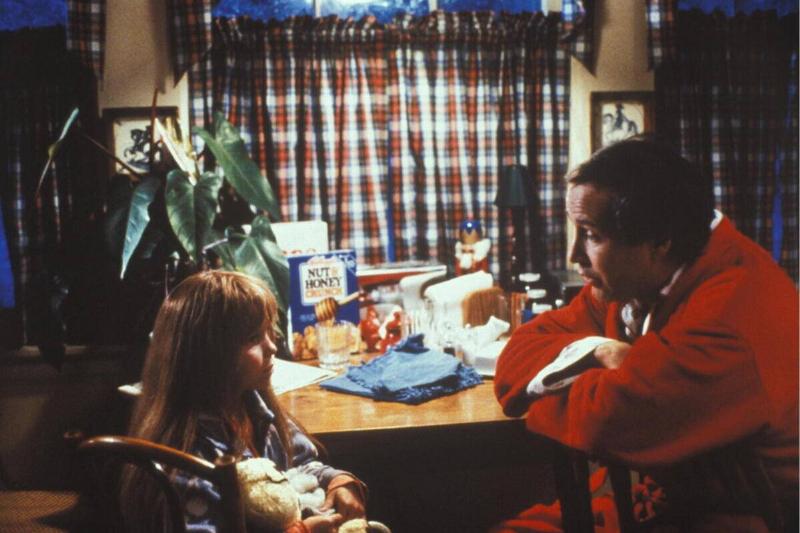 Ellen Hamilton Latzen and Chevy Chase as Ruby Sue and Clark Griswold in 'Christmas Vacation'