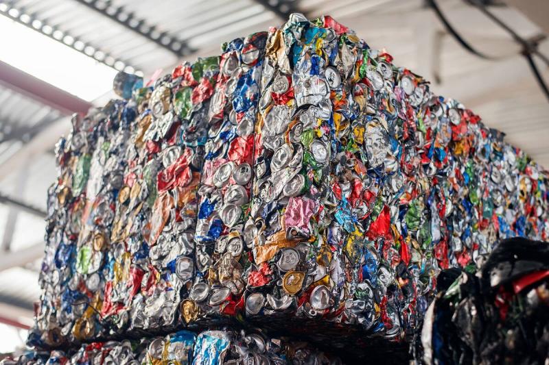 Cube of compressed metal recycling at waste sorting plant.
