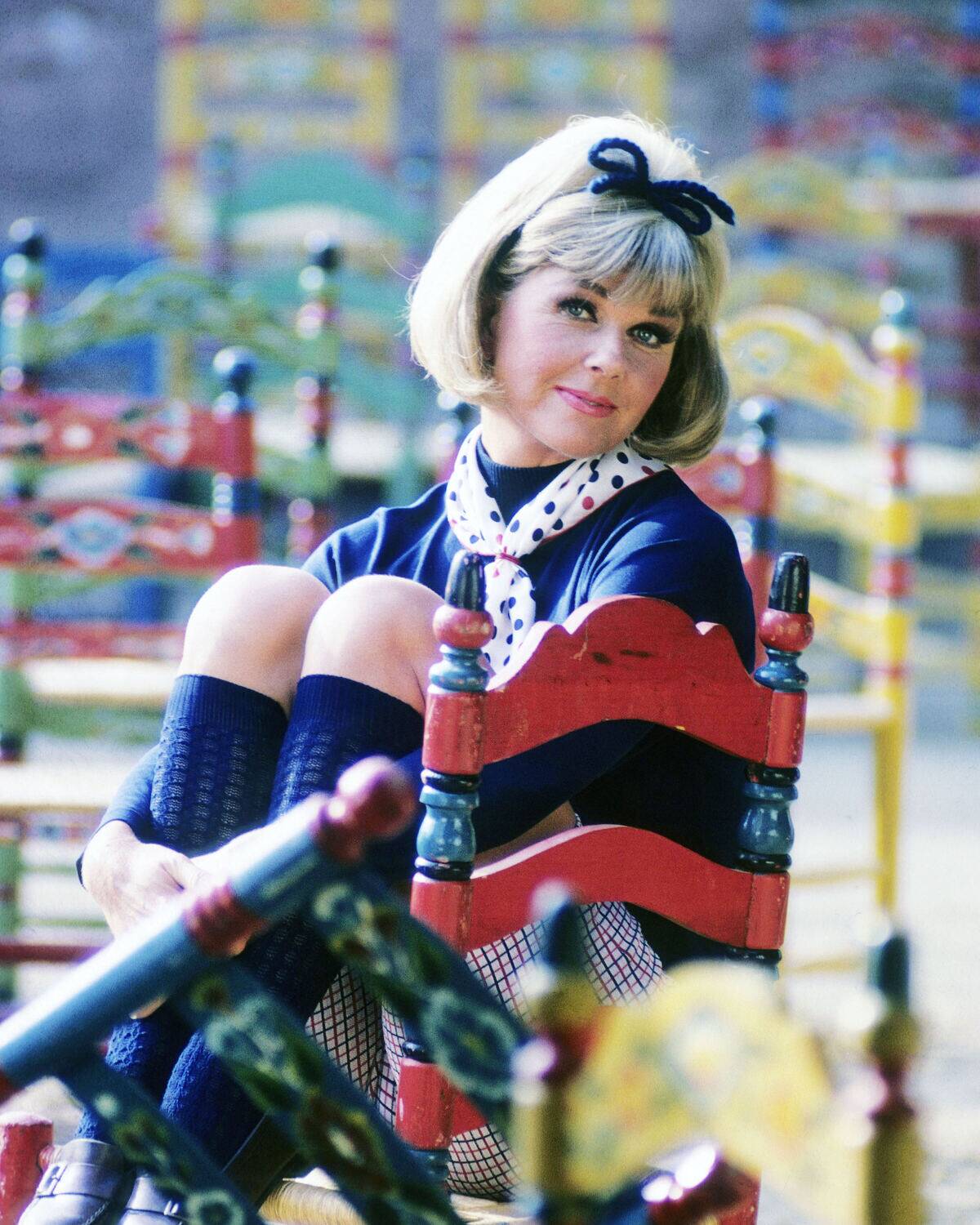 Doris Day sitting in a chair