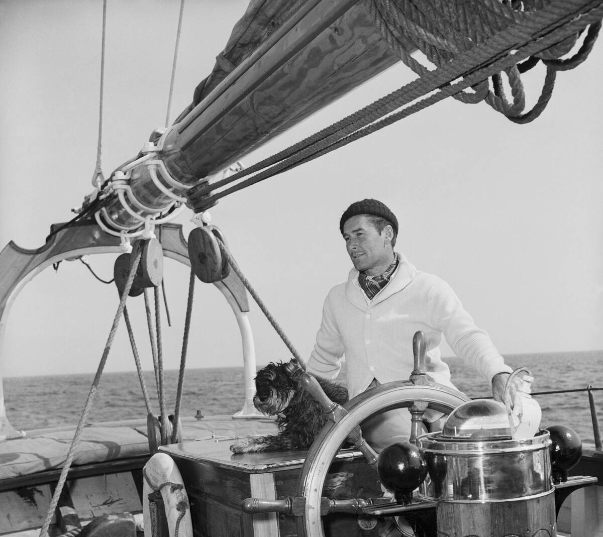 Errol Flynn manning the helm of 'Zaca'