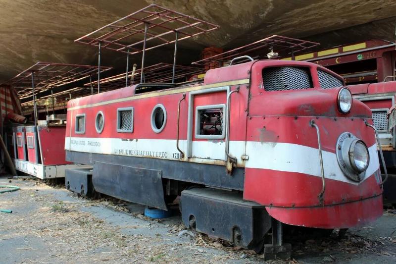 Abandoned miniature train in a building