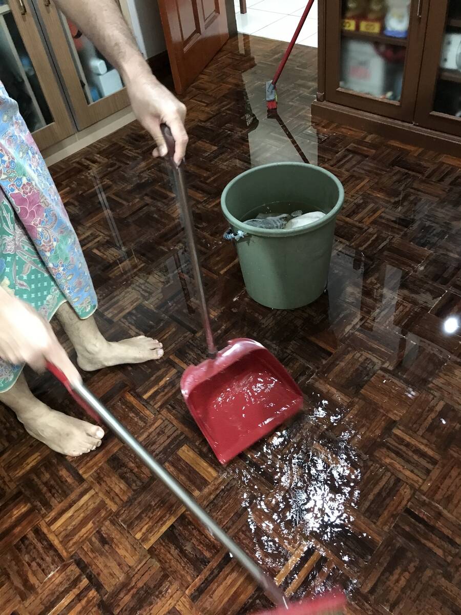 Lady cleaning floors with tons of water.
