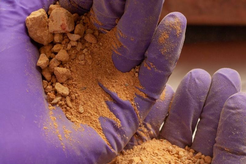 Hands Holding Sediment