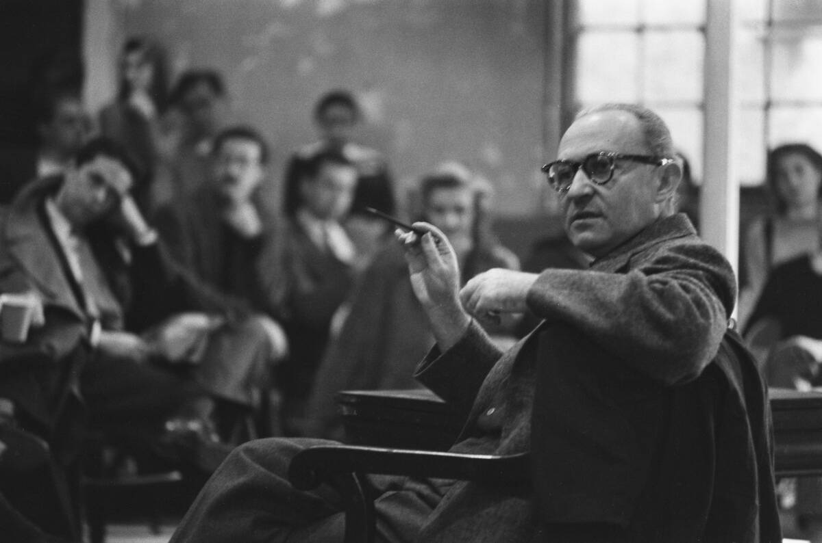 Lee Strasberg and students sitting in a classroom
