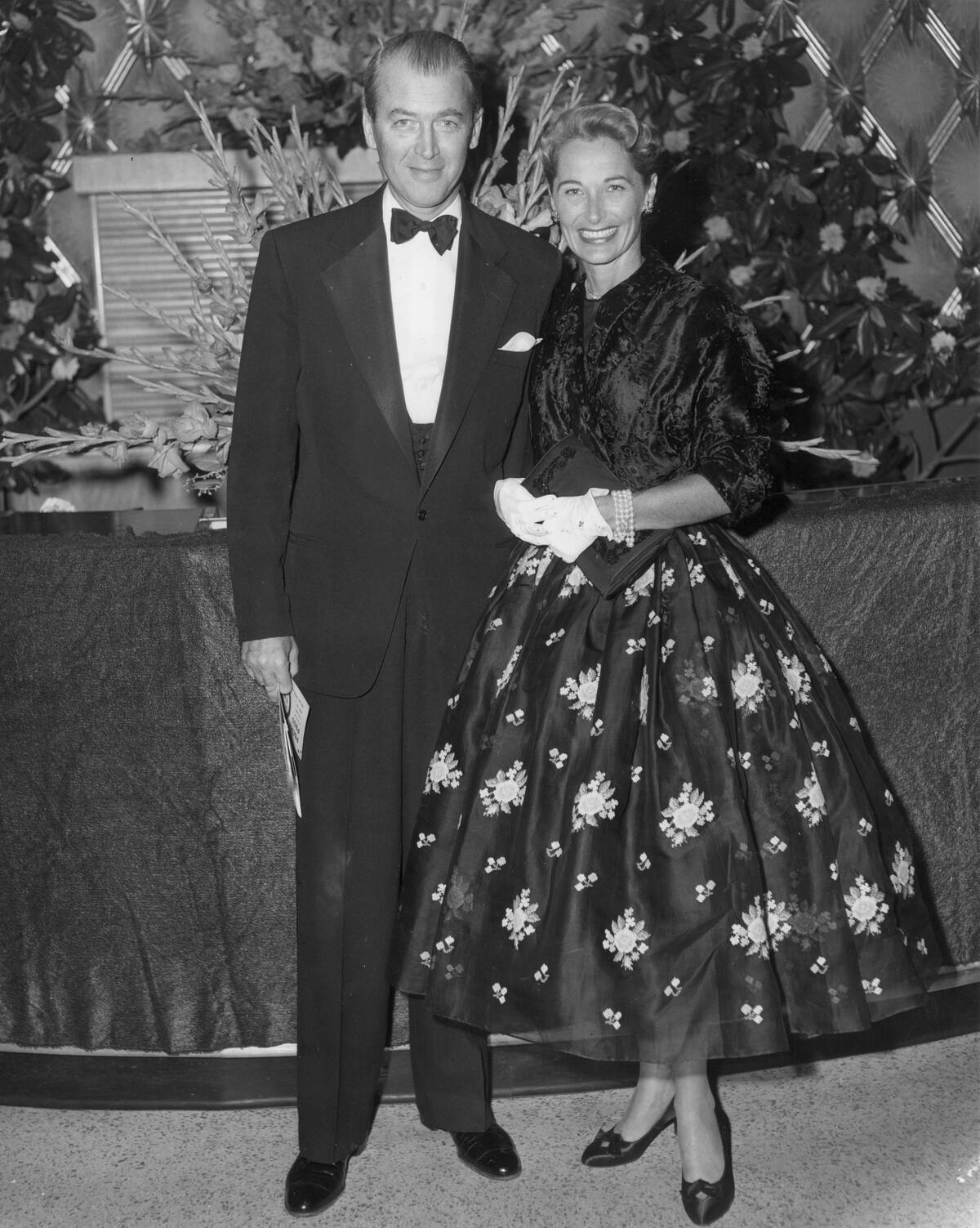 Jimmy and Gloria Stewart standing together in fancy dress