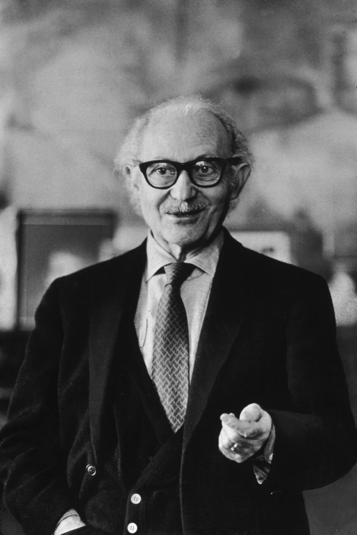 Lee Strasberg standing in his house