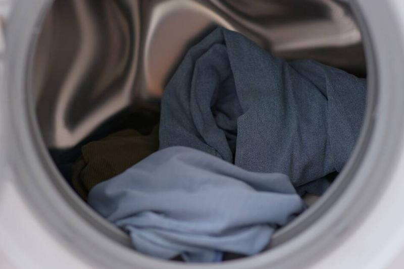 A few clothes in the washing machine. 