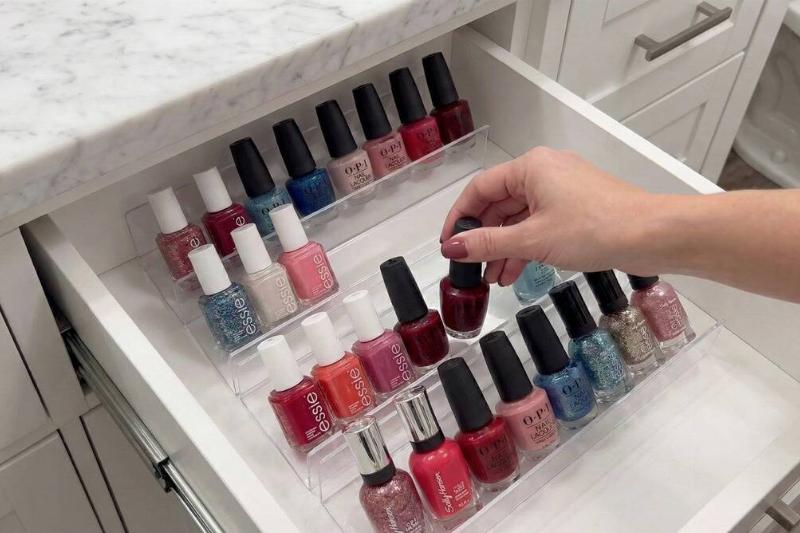 Clear picture frames used to organize nail polishes. 