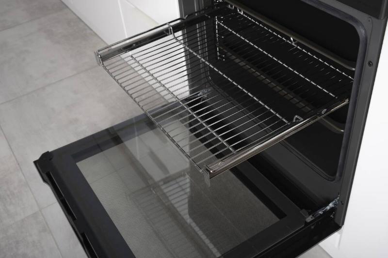 Clean oven racks inside of an oven. 