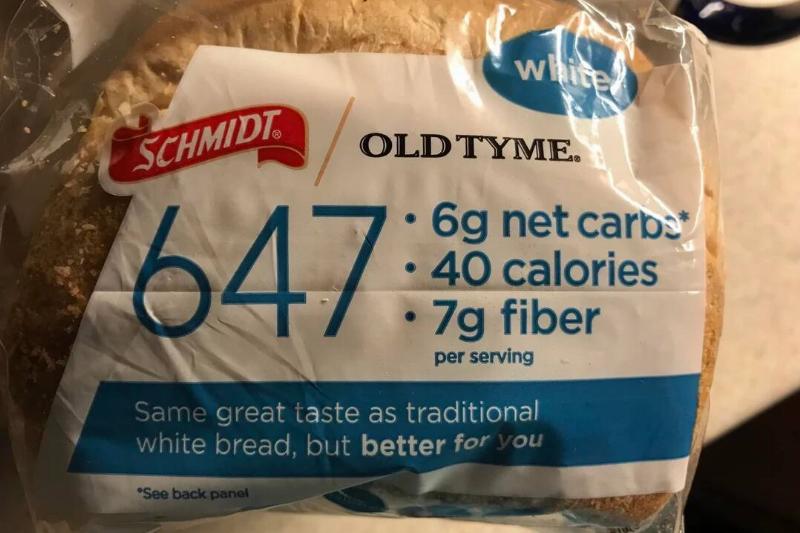 Loaf of Schmidt Old Tyme bread placed on a kitchen counter