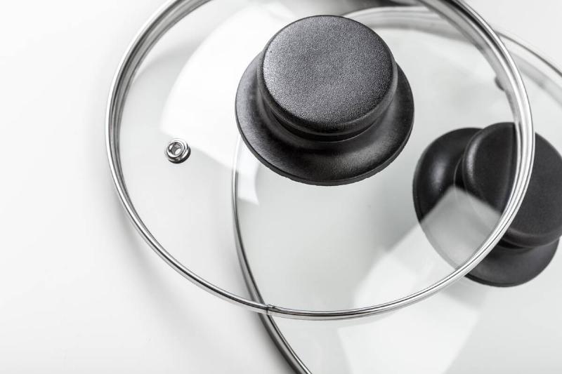 A glass pot lid with a small vent. 