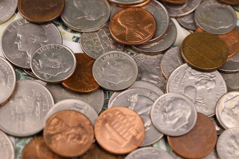 A pile of American currency coins. 