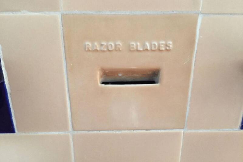 Razor blades slot in wall. 