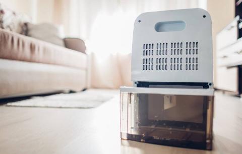 A dehumidifier with a tank for water. 