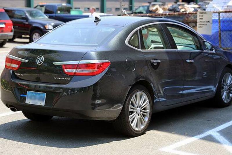 Black 2013 Buick Verano parked in a spot