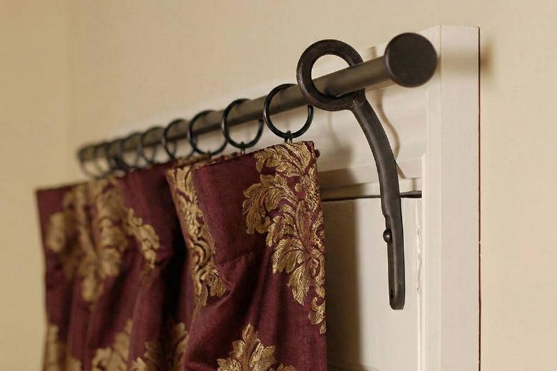A curtain rod holding up a portiere.