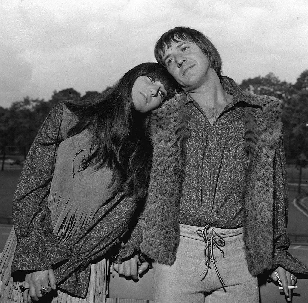 Cher and Sonny Bono standing together outside