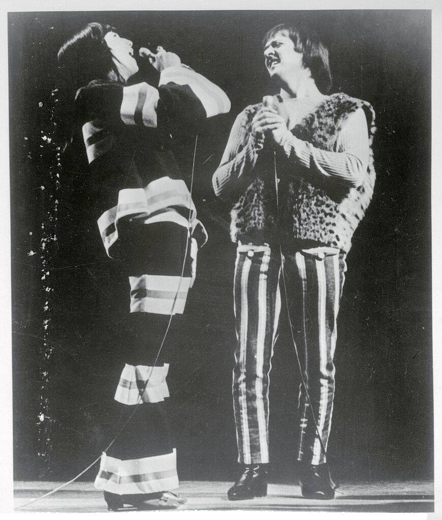 Sonny Bono and Cher singing together on stage