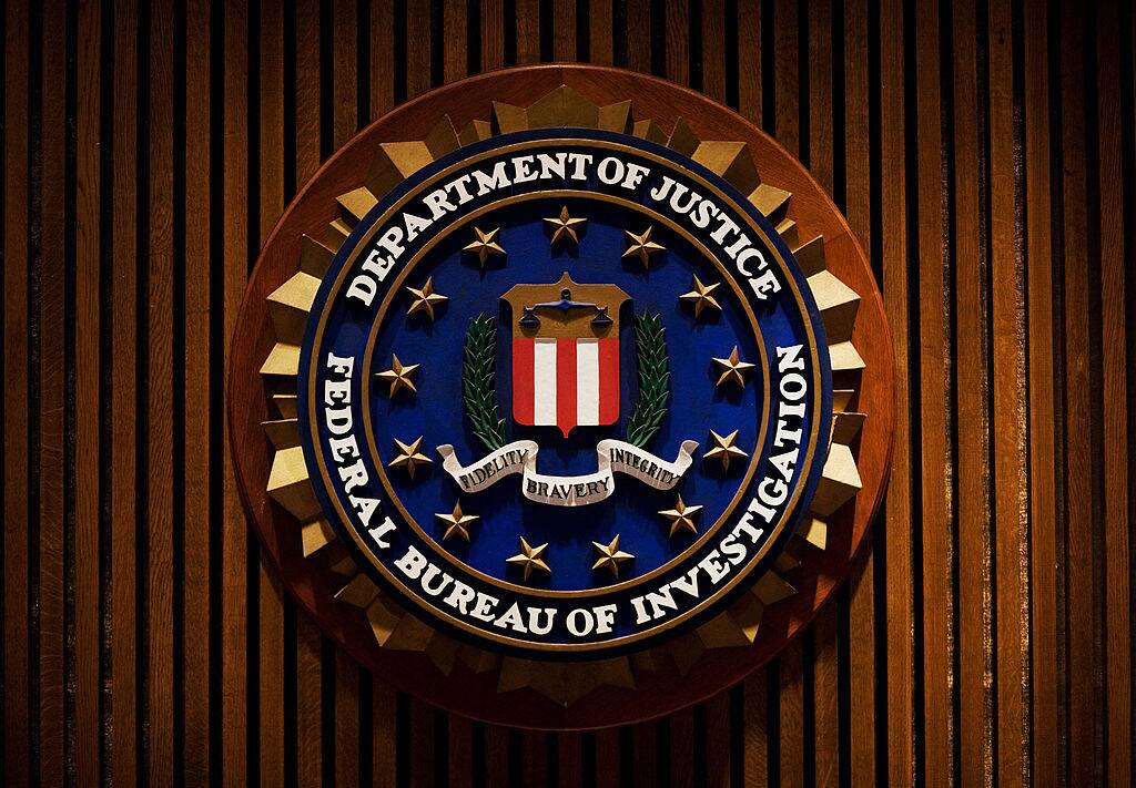 Crest of the FBI on a wooden wall