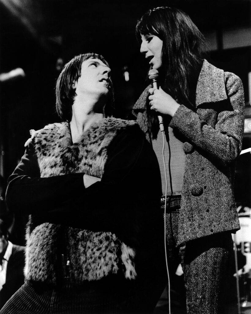 Sonny Bono and Cher singing together on stage